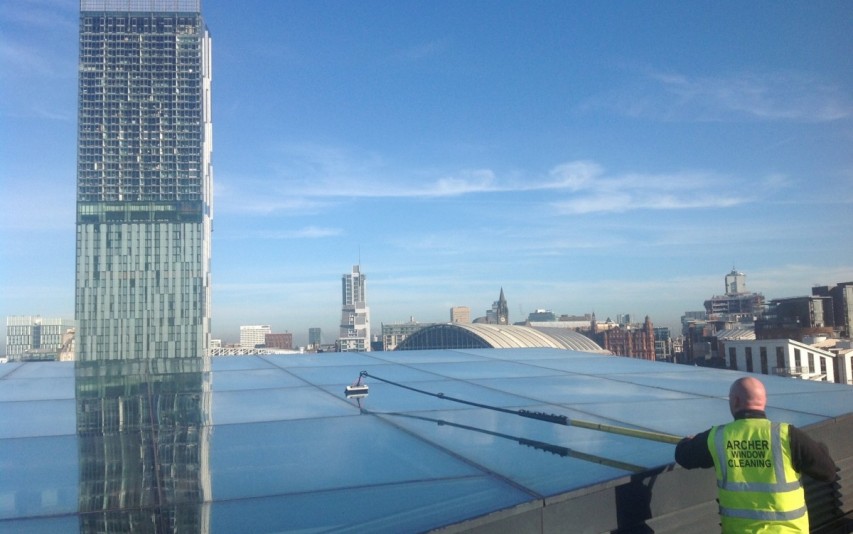 Atrium roof cleaning using reach & wash system